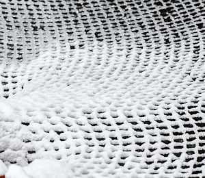 Net over pond covered with snow